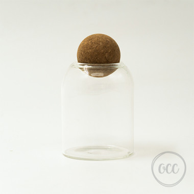 Glass container with round felt lid